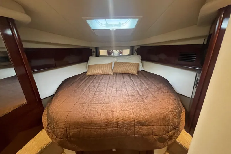 Slide: The Image of Luxurious cabin interior of 2009 Sea Ray 40 Sundancer yacht with cozy bedding. - 28
