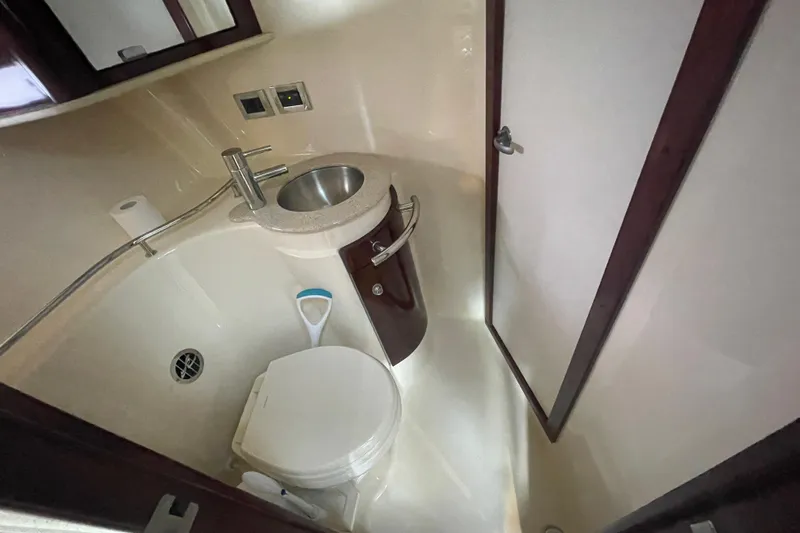Slide: The Image of 2009 Sea Ray 40 Sundancer bathroom with sink, toilet, and mirror. - 30