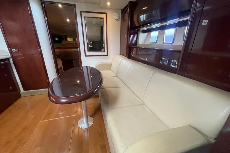 Slide: The Image of Luxurious interior of 2009 Sea Ray 40 Sundancer yacht with leather seating and wooden table. - 37