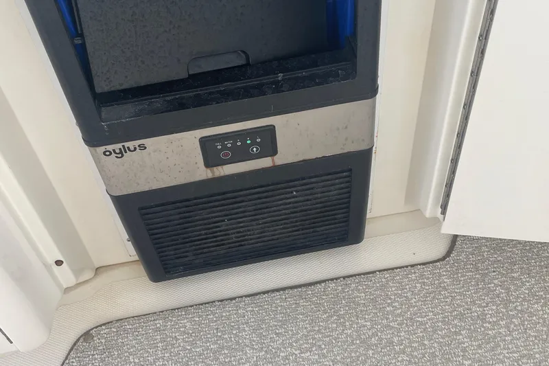 Slide: The Image of Ice maker on 2009 Sea Ray 40 Sundancer yacht, featuring control panel and vent. - 40