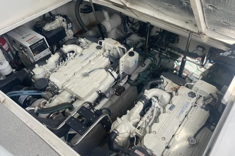 Slide: The Image of Engine room of 2009 Sea Ray 40 Sundancer yacht, showcasing dual engines and mechanical components. - 43