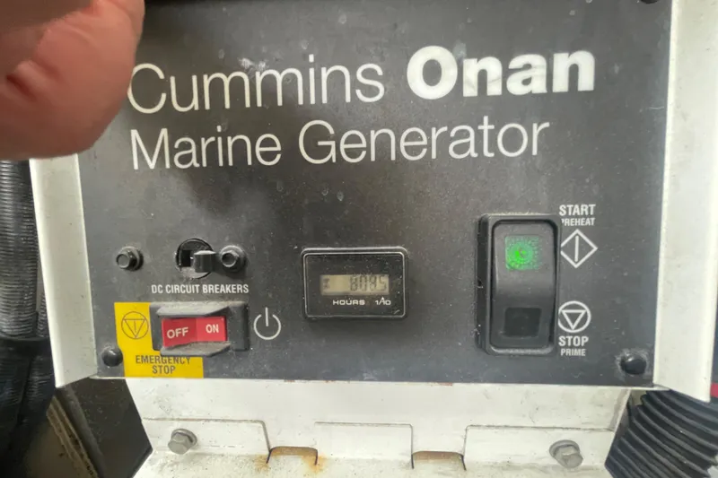 Slide: The Image of Cummins Onan marine generator control panel on 2009 Sea Ray 40 Sundancer. - 46