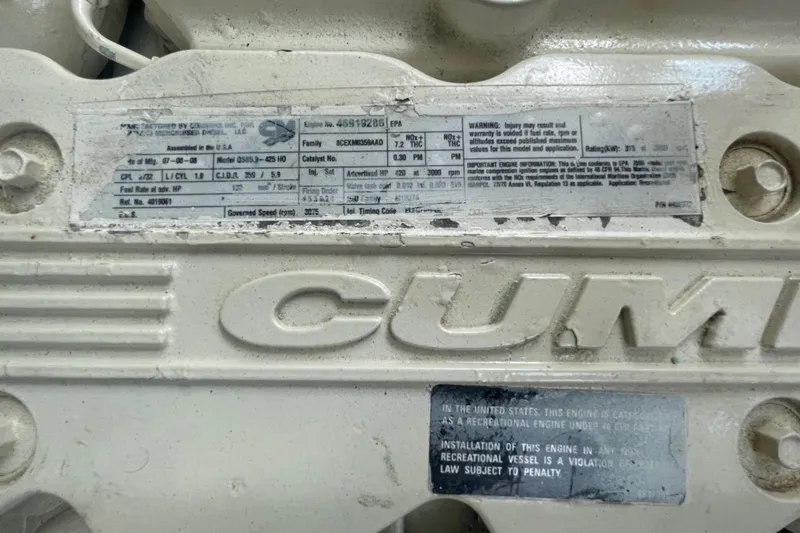 Slide: The Image of Close-up of Cummins engine label on 2009 Sea Ray 40 Sundancer. - 49