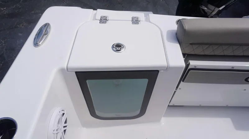 Slide: The Image of Sportsman 212 Open 2025 boat seating and storage compartment detail. - 10