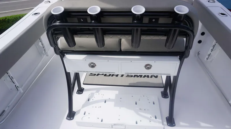 Slide: The Image of 2025 Sportsman 212 Open boat interior with rod holders and storage drawers. - 12