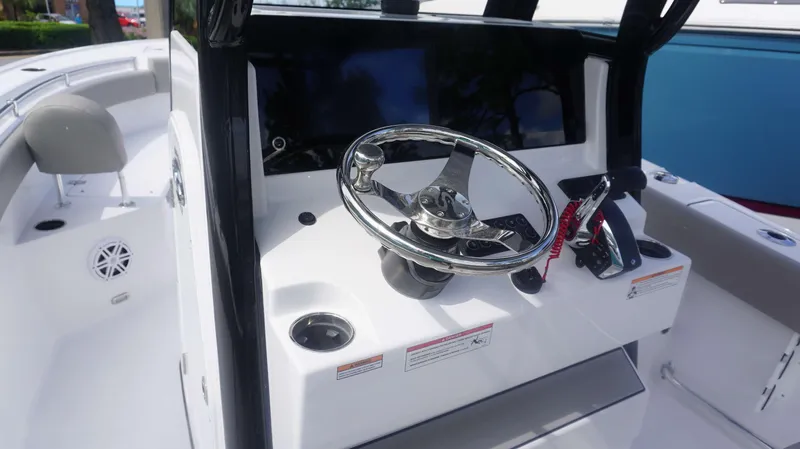 Slide: The Image of 2025 Sportsman 212 Open boat steering console with modern controls and sleek design. - 17
