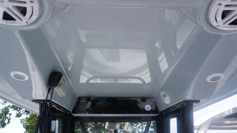 Slide: The Image of Interior view of 2025 Sportsman 212 Open boat with audio system and sleek design. - 18