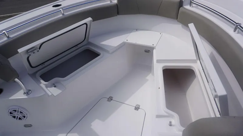 Slide: The Image of 2025 Sportsman 212 Open boat interior with storage compartments and seating. - 7