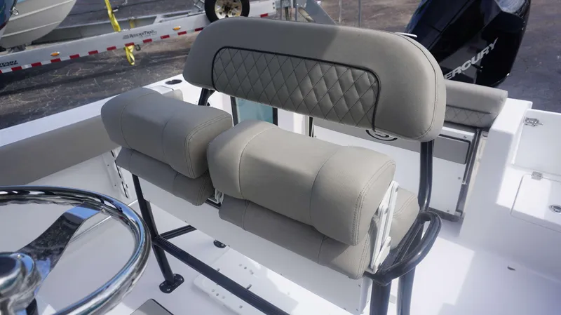 Slide: The Image of 2025 Sportsman 212 Open boat seating with cushioned backrest and steering wheel. - 8