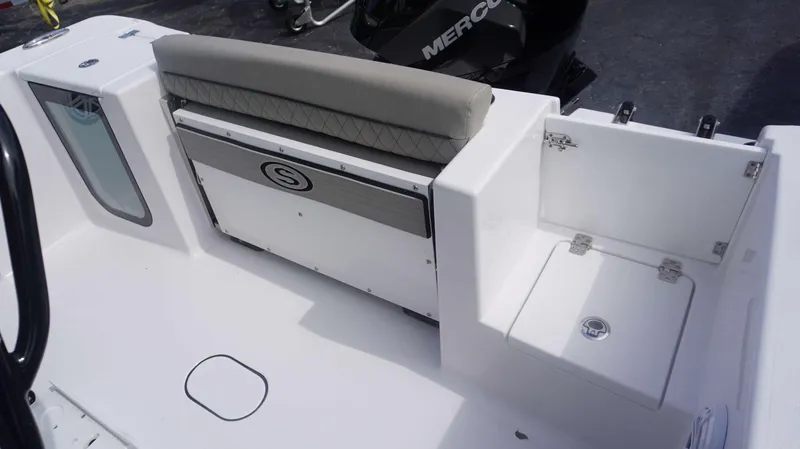 Slide: The Image of 2025 Sportsman 212 Open boat interior with seating and storage compartments. - 9