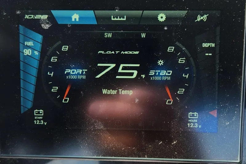Slide: The Image of Yamaha Boats SX220 2023 dashboard display showing water temperature and RPM gauges. - 11