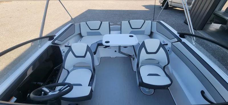 Slide: The Image of 2023 Yamaha Boats SX220 interior with seating and table. - 5