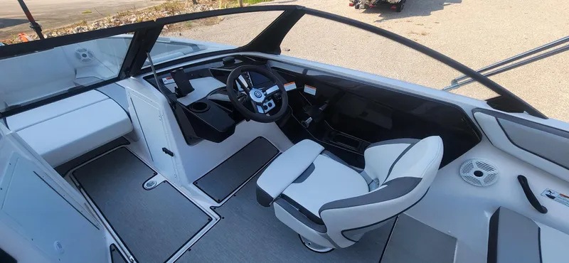 Slide: The Image of 2023 Yamaha Boats SX220 interior with modern steering and seating. - 6