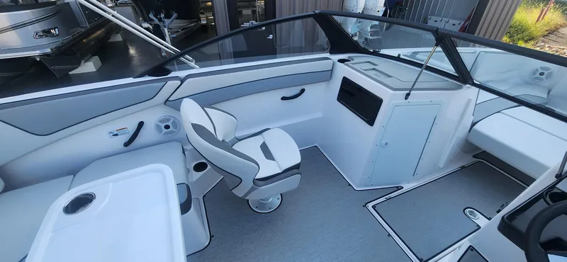 Slide: The Image of 2023 Yamaha Boats SX220 interior with sleek seating and modern dashboard design. - 7