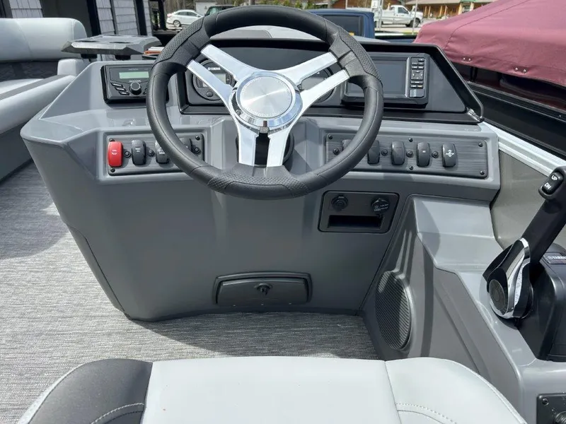 Slide: The Image of 2024 Bennington 22SSRSR boat dashboard with steering wheel and controls. - 10