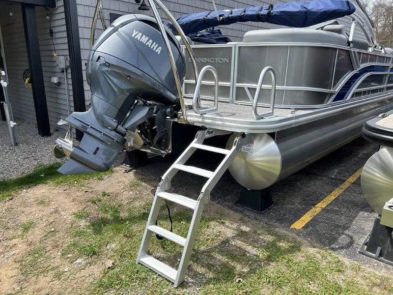 Slide: The Image of 2024 Bennington 22SSRSR pontoon boat with Yamaha motor and ladder. - 11