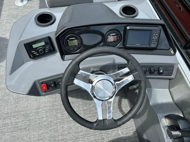 Slide: The Image of 2024 Bennington 22SSRSR boat dashboard with steering wheel and control panel. - 6