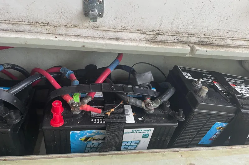 Slide: The Image of Marine batteries in a 1987 Harris Cuttyhunk Down East boat compartment. - 10