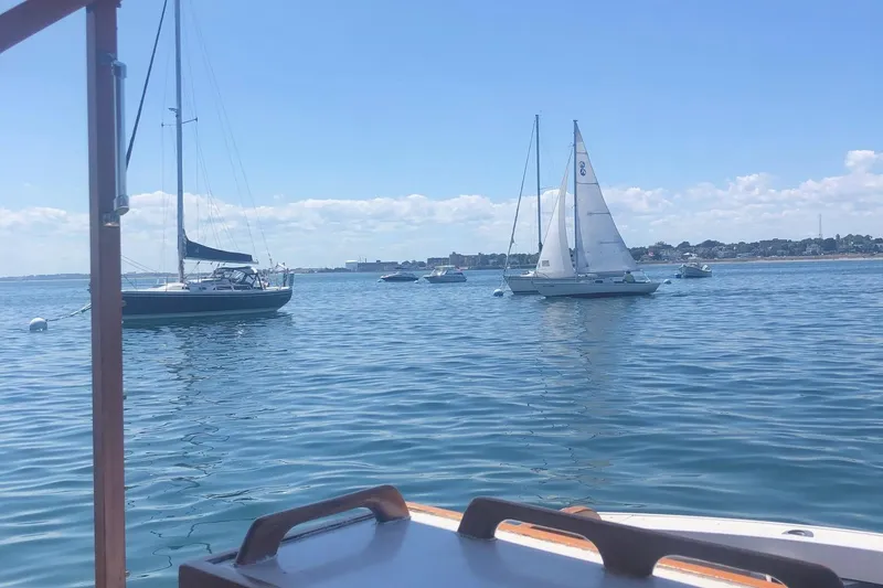 Slide: The Image of Boats sailing on calm water, view from 1987 Harris Cuttyhunk Down East. - 19