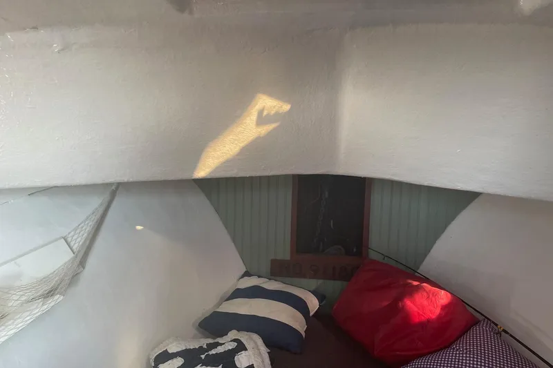 Slide: The Image of Cozy cabin interior of 1987 Harris Cuttyhunk Down East boat with cushions and natural light. - 3
