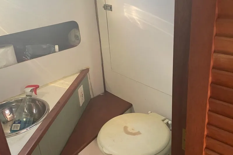 Slide: The Image of 1987 Harris Cuttyhunk Down East boat bathroom with sink and toilet. - 4