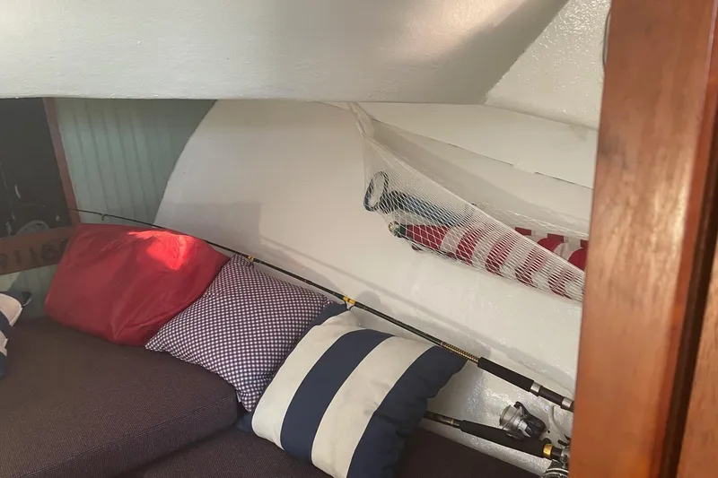 Slide: The Image of Cozy cabin interior of 1987 Harris Cuttyhunk Down East boat with striped cushions. - 5