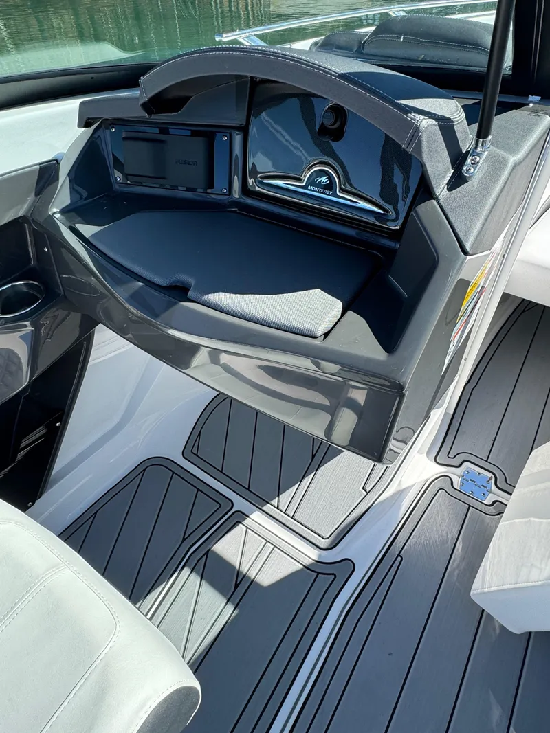 Slide: The Image of 2024 Monterey 218SS boat interior with sleek dashboard and modern design. - 10