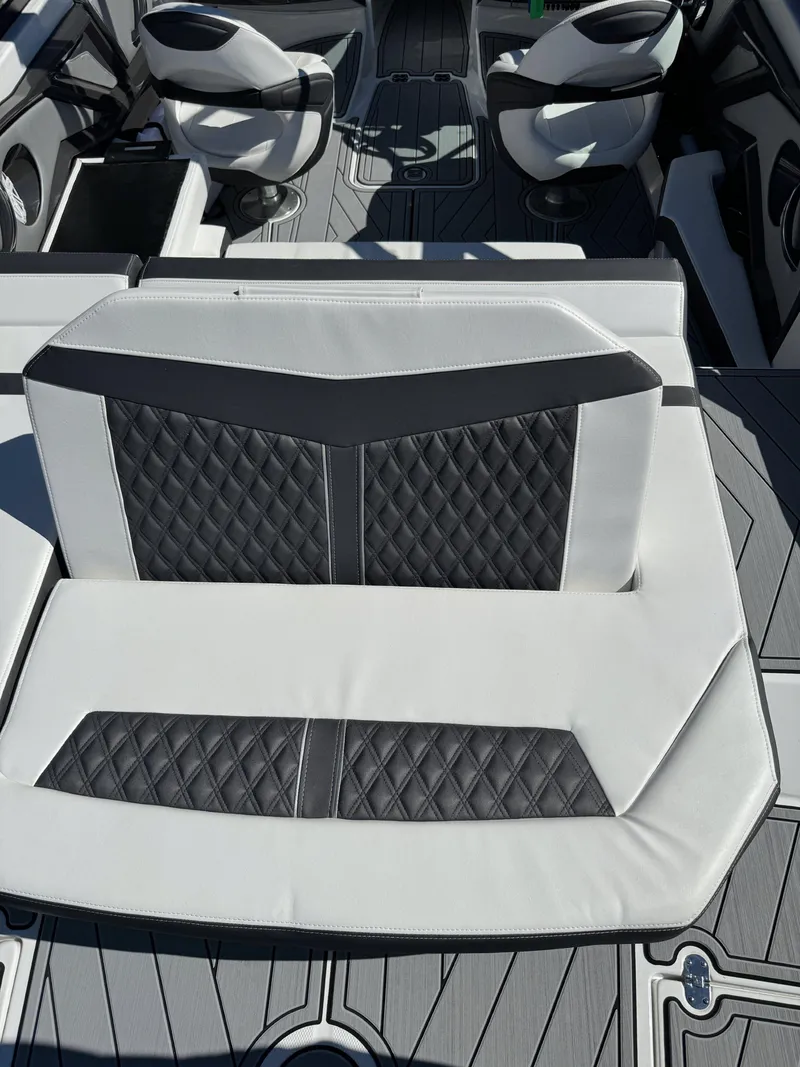 Slide: The Image of 2024 Monterey 218SS boat interior with stylish quilted seating and modern design. - 17