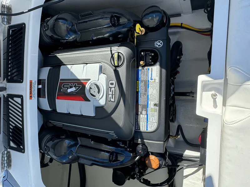 Slide: The Image of 2024 Monterey 218SS boat engine compartment with Mercury 4.5L 250 HP engine. - 23