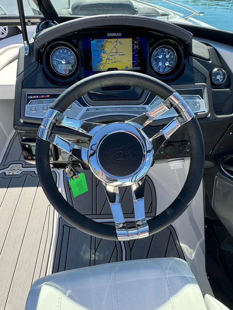 Slide: The Image of 2024 Monterey 218SS boat dashboard with steering wheel and navigation display. - 6