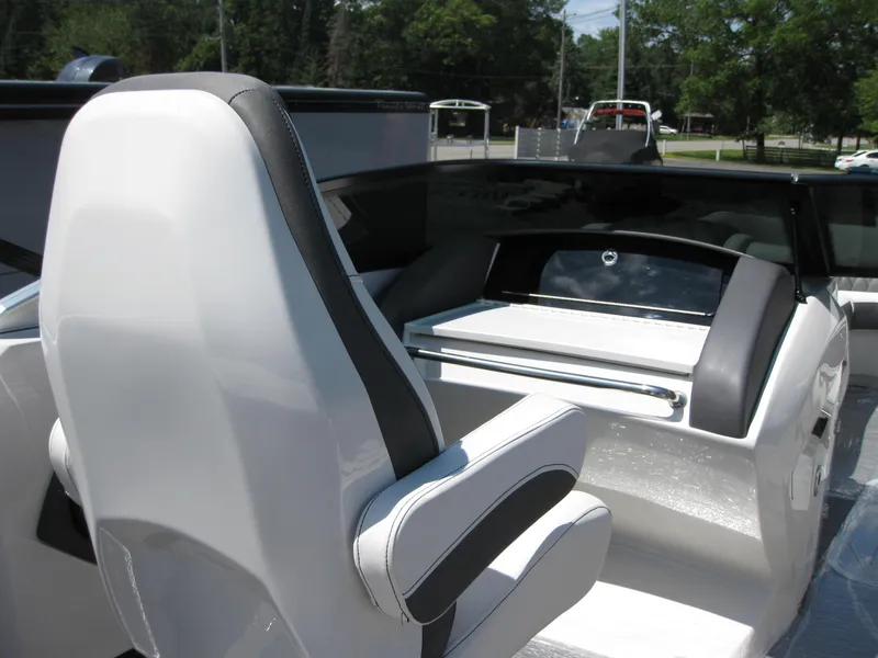 Slide: The Image of 2024 Bennington 25RX Swingback Windshield boat interior with sleek seating and modern design. - 14