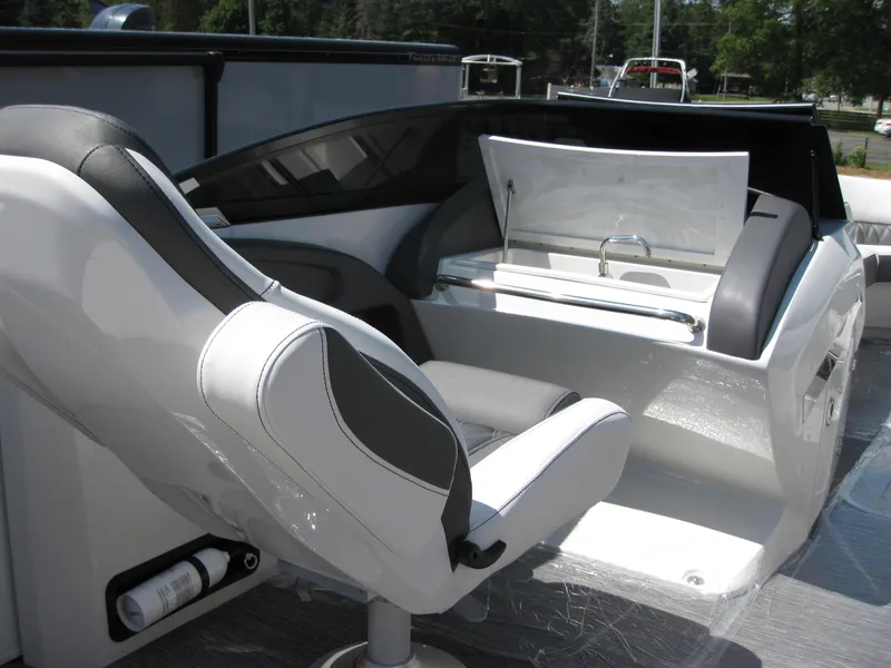Slide: The Image of 2024 Bennington 25RX Swingback Windshield boat interior with sleek seating and modern console design. - 20