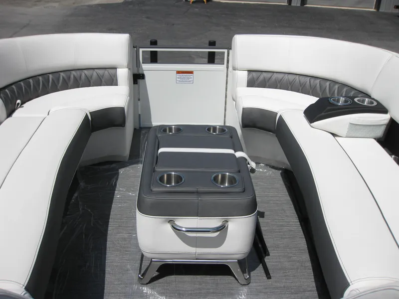 Slide: The Image of 2024 Bennington 25RX Swingback Windshield interior with luxurious seating and cup holders. - 9
