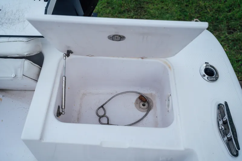 Slide: The Image of Open storage compartment on 2003 Pro-Line 32 Express boat deck. - 13