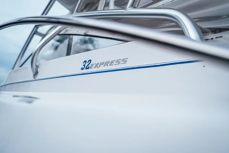 Slide: The Image of Close-up of 2003 Pro-Line 32 Express boat with sleek design and branding. - 15
