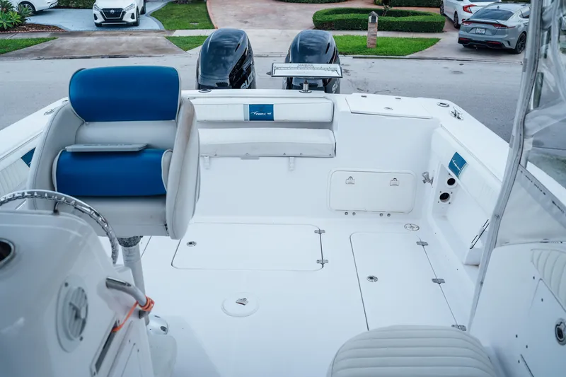 Slide: The Image of 2003 Pro-Line 32 Express boat interior with seating and storage compartments. - 3