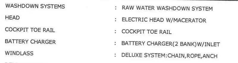 Slide: The Image of 2021 Cobia 240 Center Console features: washdown system, electric head, cockpit toe rail, battery charger, windlass. - 8