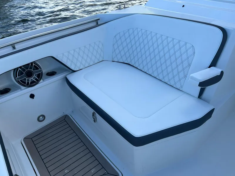 Slide: The Image of Luxurious seating on 2023 World Cat 400 DC-X boat with elegant design and speaker system. - 11