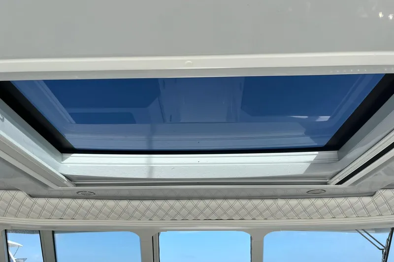 Slide: The Image of 2023 World Cat 400 DC-X boat with a sleek sunroof design. - 16