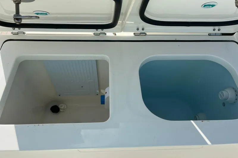 Slide: The Image of 2023 World Cat 400 DC-X boat storage compartments, open and ready for use. - 19