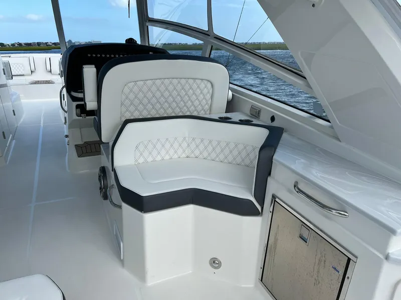 Slide: The Image of 2023 World Cat 400 DC-X interior with luxurious seating and modern design. - 7