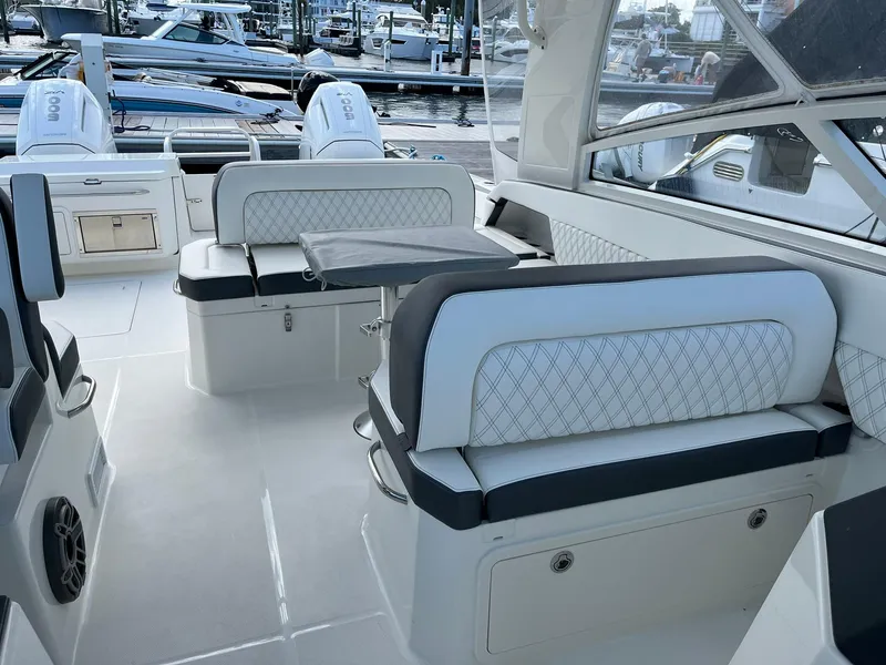 Slide: The Image of 2023 World Cat 400 DC-X boat interior with luxurious seating and modern design. - 9