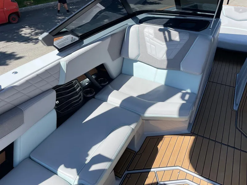 Slide: The Image of 2022 Nautique Super Air Nautique G25 interior with sleek seating and modern design. - 11