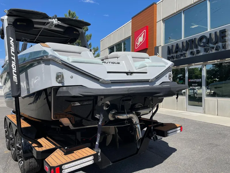Slide: The Image of 2022 Nautique Super Air Nautique G25 boat at dealership, rear view. - 4