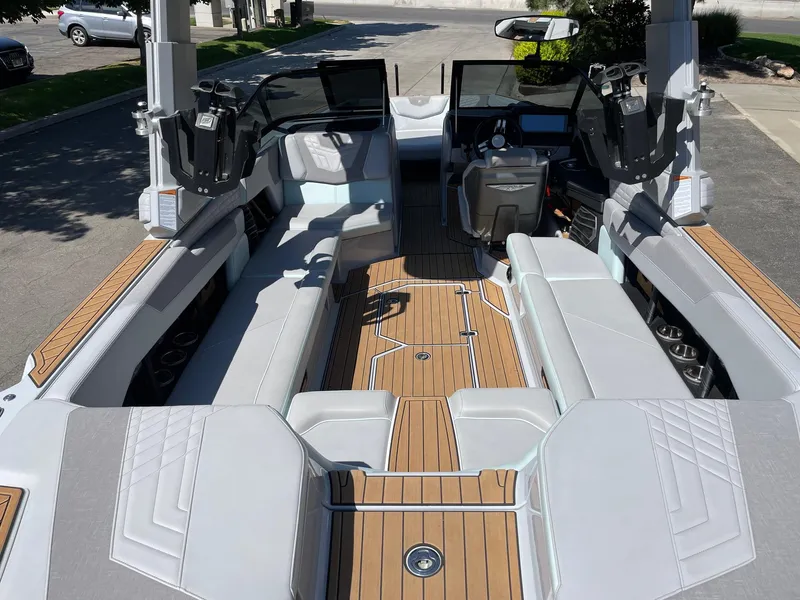 Slide: The Image of 2022 Nautique Super Air Nautique G25 interior with sleek seating and modern dashboard. - 5