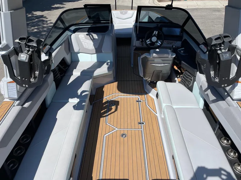 Slide: The Image of Interior of 2022 Nautique Super Air Nautique G25 boat with sleek seating and modern dashboard. - 6