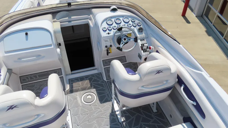 Slide: The Image of Interior of a 2003 Donzi 28 ZX Open boat with modern dashboard and seating. - 11