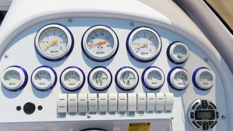 Slide: The Image of Dashboard of a 2003 Donzi 28 ZX Open boat with gauges and controls. - 14