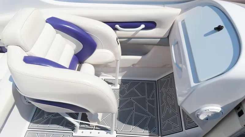 Slide: The Image of 2003 Donzi 28 ZX Open boat interior with white and purple seating, geometric floor design. - 16