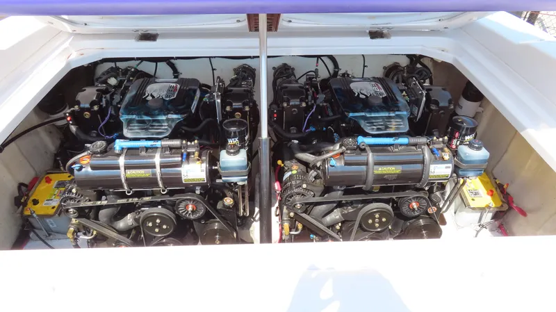 Slide: The Image of Twin engines of a 2003 Donzi 28 ZX Open boat, showcasing detailed mechanics. - 21